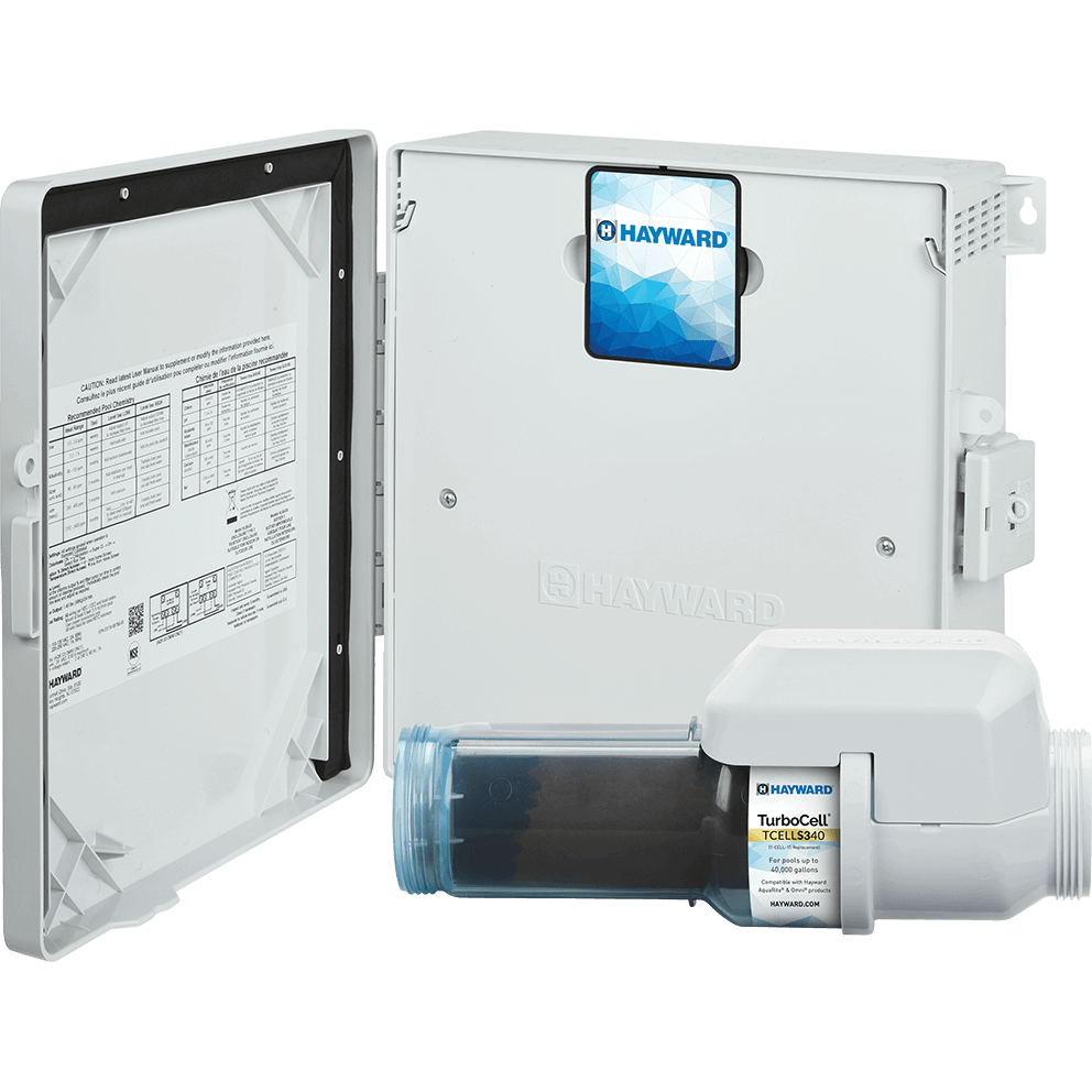Angled product view of the Hayward AquaRite S340 40,000 Gallon Salt System with the TurboCell S340 salt cell placed in front, shown on a transparent background. The control enclosure is open with the door swung to the left; the inside of the door displays a large printed instruction panel with tables and small diagrams, bordered by a dark gasket around the door frame. The main enclosure body is on the right and faces forward, but instead of the LCD screen being visible, the top centre area shows a blue geometric Hayward-branded panel insert with the Hayward logo at the top. Two silver screws are visible on the enclosure face, one left of centre and one right of centre, and side mounting tabs and venting are visible along the right edge. In the foreground across the bottom, the TurboCell S340 lies horizontally, with the translucent blue threaded union end on the left and the white sensor housing on the right; the clear chamber exposes the dark internal plates, and the white label band near the right side reads TurboCell branding with the model “TCELLS340” and “For pools up to 40,000 gallons” visible in smaller text.
