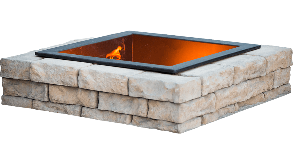 Isolated product view of the Rosetta® Dimensional Fire Pit Kit on a transparent background, showing its full rectangular shape and stone-inspired detail. The pit is made from two layers of light-beige and grey precast concrete blocks with irregular, chiseled textures that convincingly replicate natural stone. The matte-black steel insert frames a vivid orange flame glowing within the pit’s hollow centre. Shadows along the stone surfaces highlight depth, contour, and craftsmanship. Without any visible surroundings, the image focuses attention on the realistic stone design that makes the Dimensional Fire Pit Kit an ideal way to transform patios and backyards into inviting, warm retreats for year-round enjoyment.