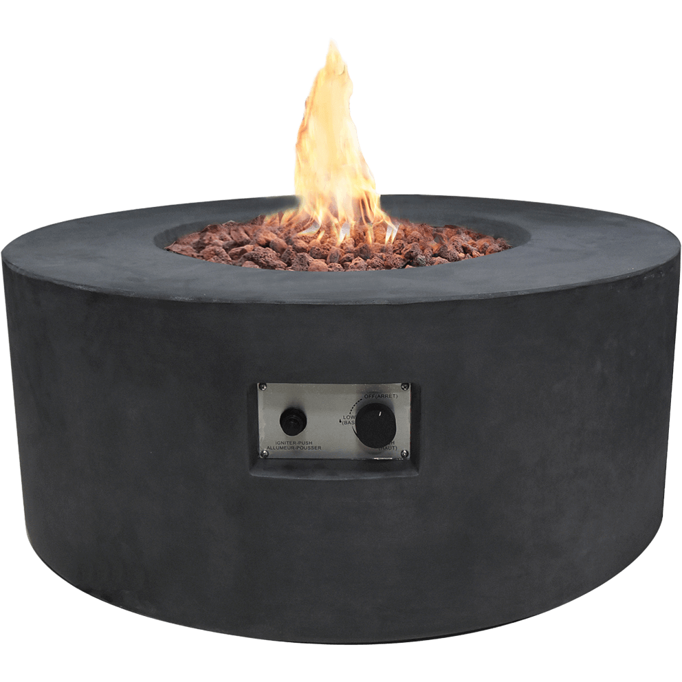 A clean product image of the Modeno Venice Fire Table isolated on a white background. The fire table is round with a smooth matte black concrete body and a wide horizontal top rim. The centre contains a recessed burner filled with coarse red and grey lava rock, with a tall flame rising from the middle. On the front face of the fire table is a rectangular stainless steel control panel containing an ignition button and a flame adjustment dial. The overall form is low, cylindrical and minimalist, emphasising its handcrafted concrete construction.