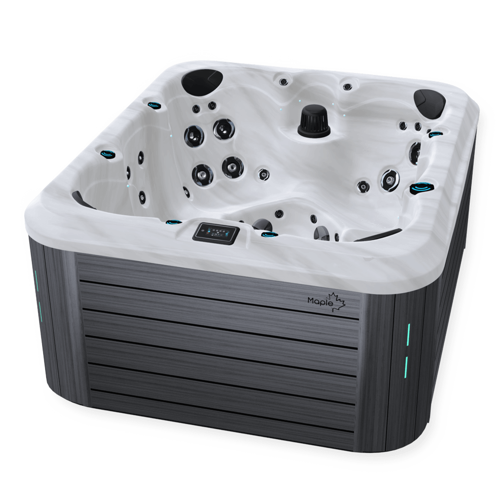 Angled view of a premium hot tub with a sleek sterling marble-patterned interior and grey horizontal exterior paneling. The tub includes multiple ergonomic seating areas with a variety of hydrotherapy jets, a central black filter component, a digital control panel on the rim, and subtle LED lighting accents. The Maple Spas logo is visible on the side panel.