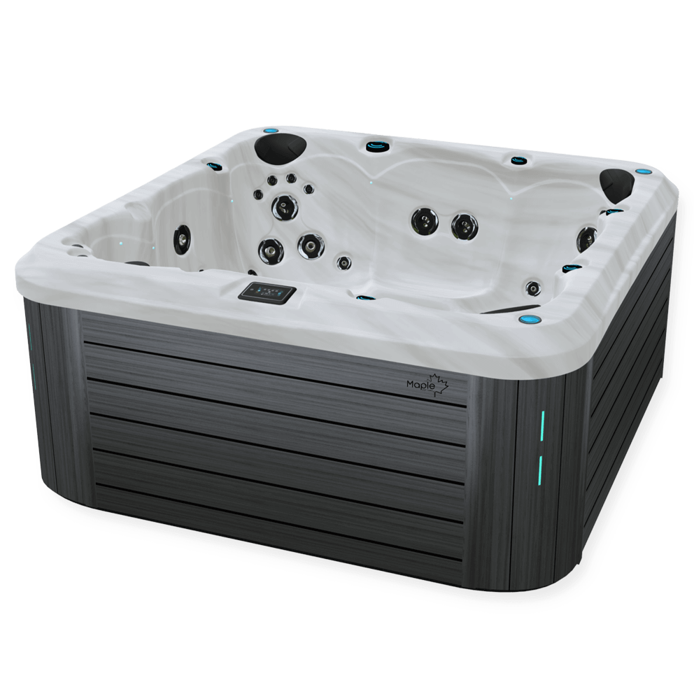 Angled view of a Maple Spas M820 hot tub showcasing its modern design with a sleek grey horizontal-paneled exterior, a sterling white marble-like interior featuring multiple hydrotherapy jets, headrests, and a digital control panel on the rim.