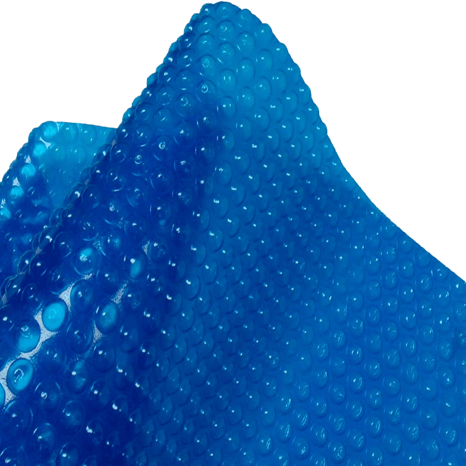 Close-up image of a bright blue solar blanket designed for above ground pools. The blanket is made of durable plastic and features a textured surface covered with evenly spaced air-filled bubbles, similar to bubble wrap. These bubbles help trap heat from the sun to warm the pool water and reduce evaporation. The blanket is shown partially folded to display its flexible material and bubble pattern.