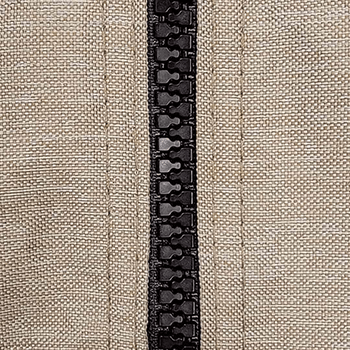 Macro view of the "Taupe" Private Drape fabric used in the Visscher Stella gazebo, showing a woven texture in a soft, natural taupe colour. Prominently featured is a black central zipper with interlocking teeth, flanked by precisely stitched vertical seams on both sides, adding a functional and refined touch to the durable, canvas-like material.