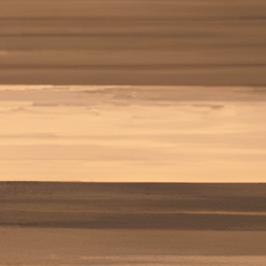 Close-up image of the "Cedar" panel colour option for Visscher gazebos and pergolas, showcasing a rich blend of warm amber and golden brown hues in a horizontally brushed finish. The surface mimics natural cedar wood with linear striations and layered shades, creating a dynamic visual effect reminiscent of real wood panels. This vibrant finish is suited for creating inviting, earthy outdoor environments with a touch of rustic charm.