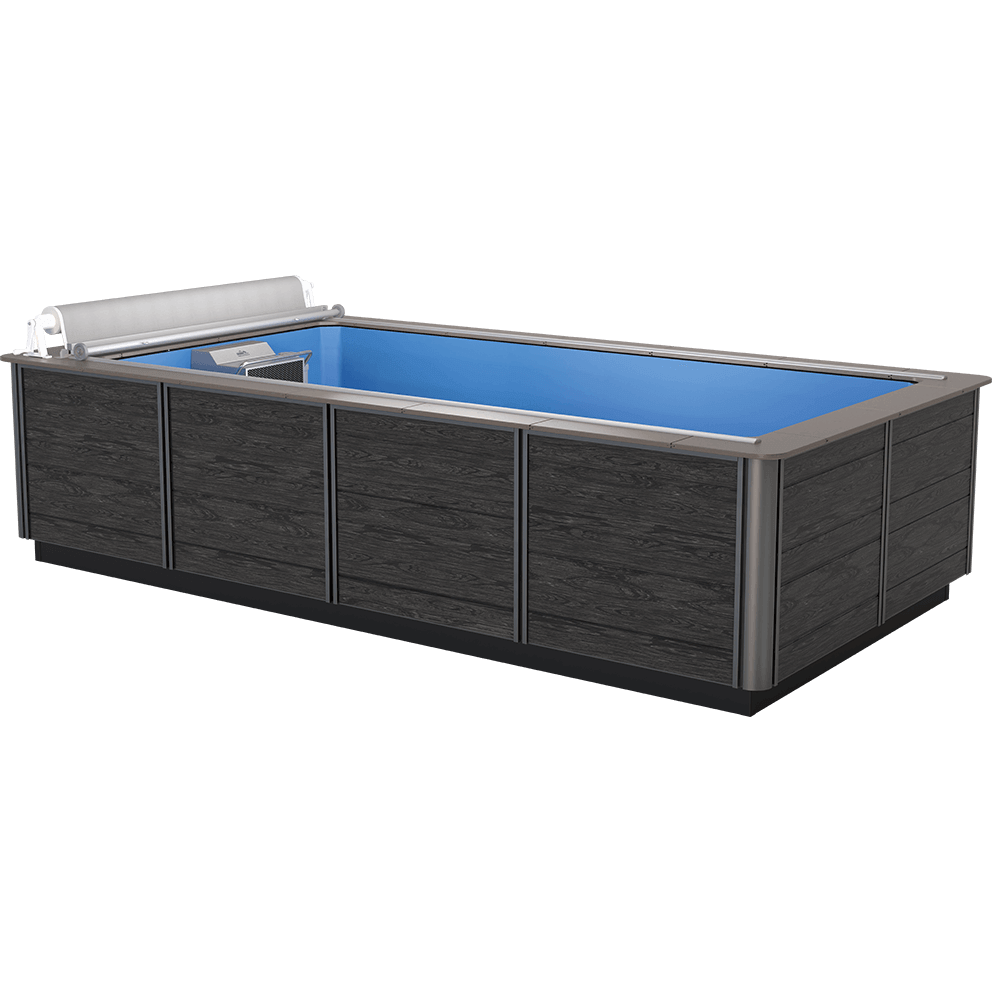 Front left-angled view of the Endless Pools EP407 Modular Pool, showcasing a sleek black composite exterior cabinet with vertical trim accents and panel textures that resemble deep-grained wood. The pool has a silver metallic coping edge framing the bright blue interior swim area. At the far left end is the integrated Hydrodrive™ propulsion system unit, visible above the waterline, encased in a stainless-steel housing with a central outlet grille and a large circular adjustment dial to the right. Above the propulsion system, a silver automatic cover is rolled up on its track, spanning the full pool width. The modular side panels are evenly spaced and bordered by slim metallic corner posts, creating a modern, clean appearance.