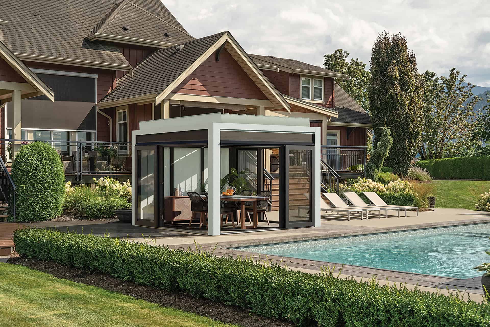 Detailed close-up of the Stella Fully Enclosed Pergola roof mechanism, showing a row of silver-grey horizontal aluminium louvres held in place by black brackets and visible silver bolts. Coiled tension springs are mounted along the edge frame, all silhouetted against a clear bright blue sky.