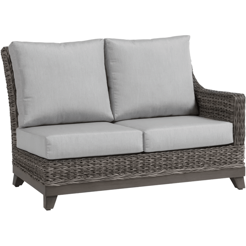 Angled view of the Asheville Furniture Collection two-seat right sectional piece, styled as a loveseat with seating for two. The frame is constructed with handwoven weathered resin wicker, complemented by two thick grey Sunbrella fabric seat cushions and two tall padded backrests. The right-side armrest is fully visible, and the left side is open to connect with other sectional components. The dark tapered legs provide a stable base and complete the sophisticated outdoor design.