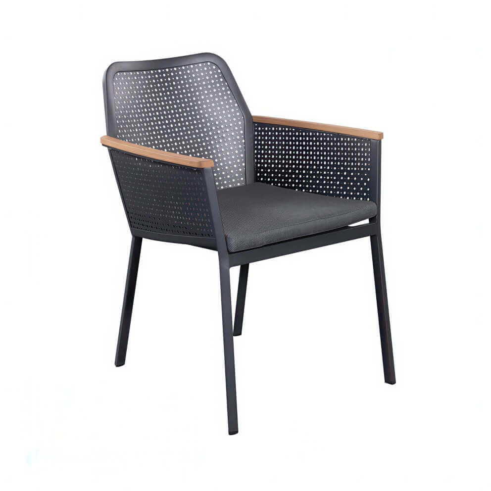 Slate grey Oslo Dining Chair from the Oslo Dining Collection, shown at an angled front-side view. The chair features a sturdy black metal frame with four slim legs, a perforated metal backrest and side panels for breathability, and flat wooden armrests with a natural wood finish. The seat includes a thick, padded dark grey cushion for comfort. Its clean lines and mixed materials combine to create a modern, minimalist look suitable for both indoor and outdoor dining.