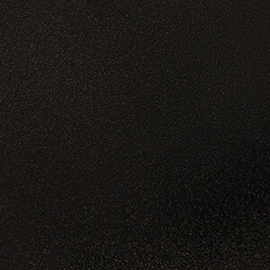 Close-up of the Black colour option for the oven unit of the Quarry Stone Compact Pizza Oven, featuring a smooth matte black metallic surface. The texture is slightly pebbled, giving the finish a durable, industrial look while maintaining an elegant, modern aesthetic that contrasts beautifully against lighter stone materials.