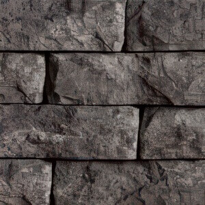 Close-up of the Pacific Grey colour option, displaying cool grey stone blocks with intricate, rough textures and faint undertones of slate and charcoal. The pattern highlights natural stone layering and shadowed fissures that add visual depth and an authentic hand-cut stone appearance.