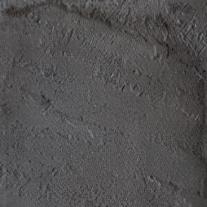 Close-up of the Northern Charcoal colour option, featuring a dark, solid grey surface with fine stone texture and muted tonal shifts. The finish appears slightly rugged and weathered, giving the impression of freshly quarried basalt or charcoal slate, ideal for modern or industrial-style landscapes.