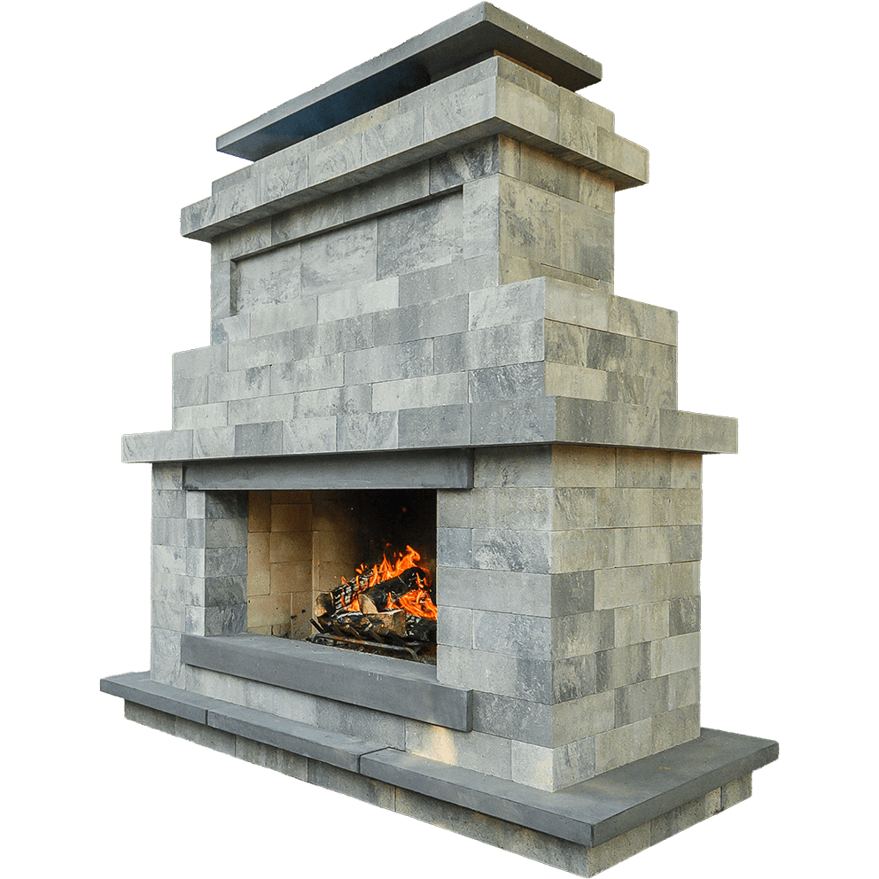 Angled front view of the Caliber Stone Fireplace, showcasing its layered rectangular structure crafted from Sterling-coloured concrete blocks with subtle grey variations. The dark charcoal mantel and base contrast against the pale stacked stone finish, while a warm orange flame glows from the recessed firebox. The clean geometric design and modular symmetry emphasise versatility and sophistication, embodying the idea of one kit built your way for any outdoor living space.