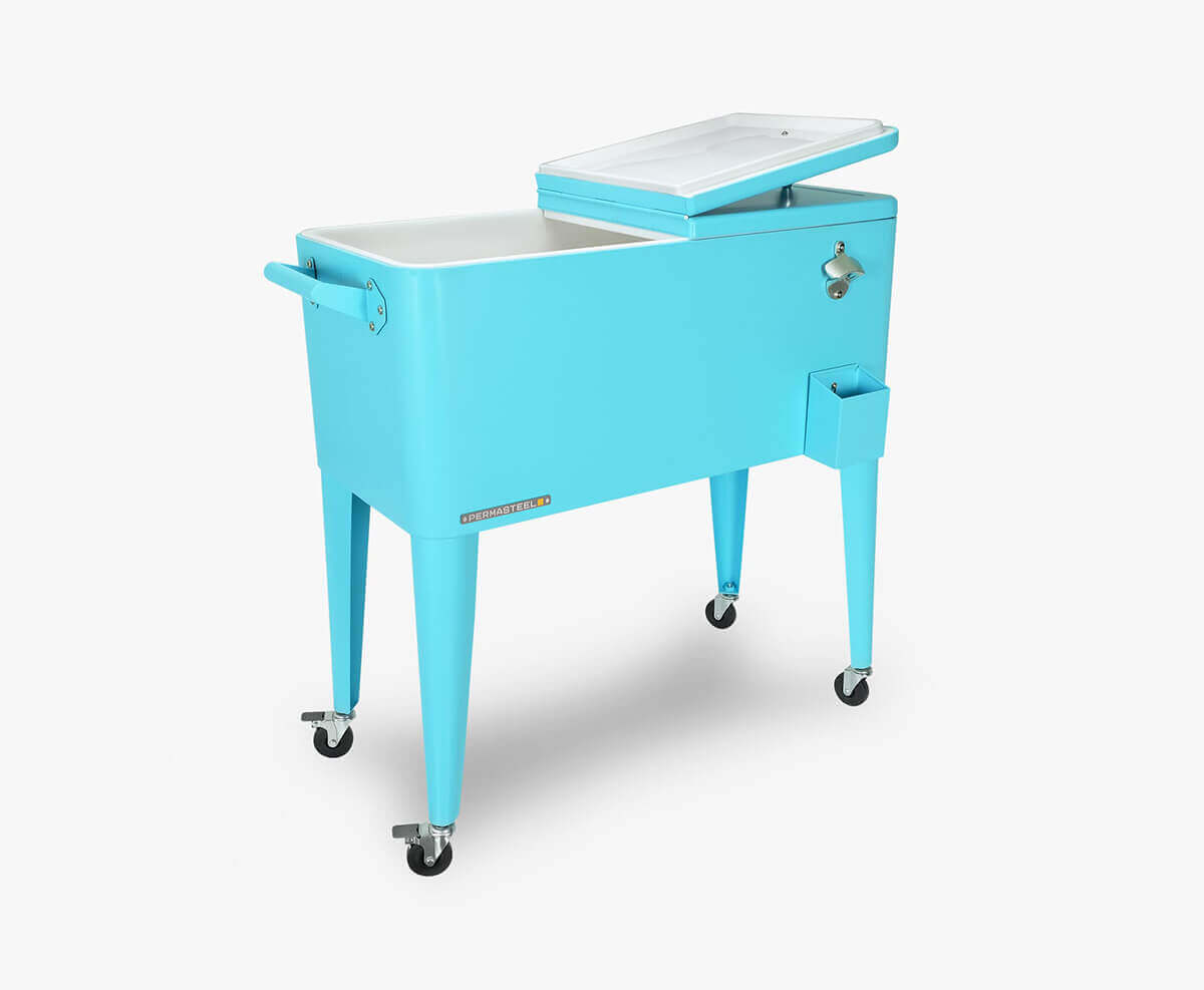 Angled view of the Permasteel 80qt rolling cooler with one of its split lids open, revealing a spacious white insulated basin. The cooler’s bright turquoise exterior contrasts with the smooth interior lining. The right side includes a mounted bottle opener and cap catcher, and the sturdy steel frame rests on four lockable caster wheels. This view highlights convenient access and portability, perfect for hosting gatherings or outdoor events.