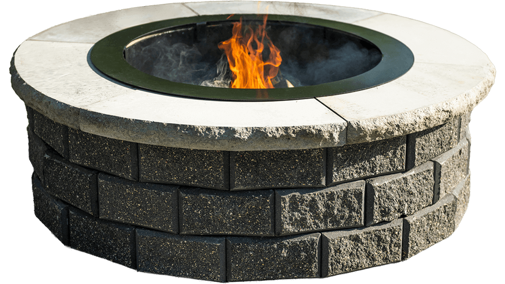 Isolated angled product view of the Barkman StackStone® Fire Pit on a transparent background, clearly displaying its full circular design and material details. The structure is composed of two tiers of dark grey, textured StackStone® concrete blocks with slightly beveled faces that catch light and shadow for depth. Each block has a naturally pitted, stone-like finish and faint colour variations from charcoal to ash grey. The top coping ring consists of roughly hewn light-beige stones with a coarse, chipped outer edge and a smooth inner curve. A black metal liner sits securely in the centre, surrounding a vivid orange and yellow flame burning within. The transparent background emphasises the product’s form and texture without environmental distraction, ideal for e-commerce or catalogue use. This image perfectly showcases the craftsmanship and sturdy design that let homeowners Add Warmth to Their Backyard with elegance and durability.