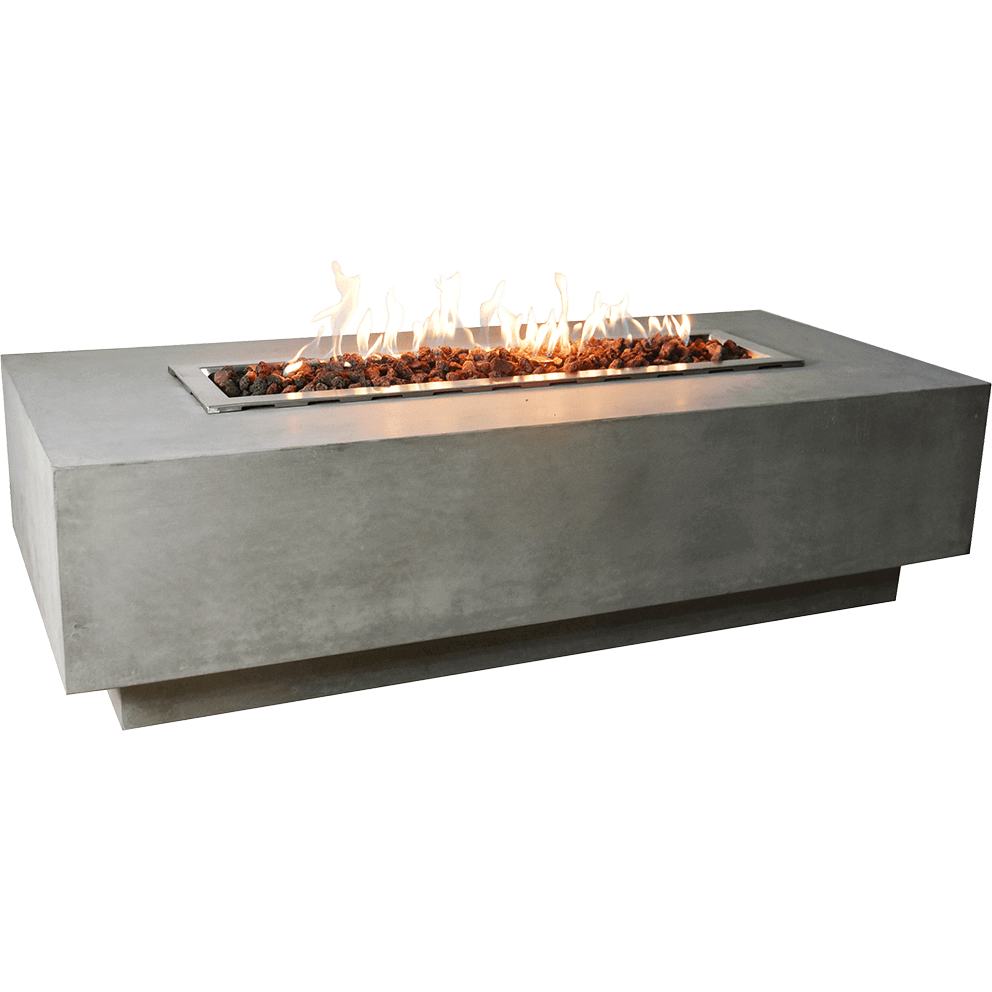 A studio image of the Elementi Granville Fire Table with its flame ignited. Vibrant yellow and orange flames rise above the lava rock bed. The smooth light grey concrete surface and crisp geometric form are clearly visible, with the table isolated on a transparent background.
