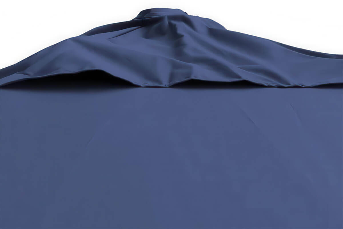Close-up image of the navy-blue Offset Suspension Umbrella canopy viewed from below the vented top section. The double-layer vent allows airflow for wind resistance while maintaining a smooth, elegant drape across the fabric surface. The rich navy tone and crisp fabric folds highlight the umbrella’s quality craftsmanship and weather-resistant material suited for outdoor durability.