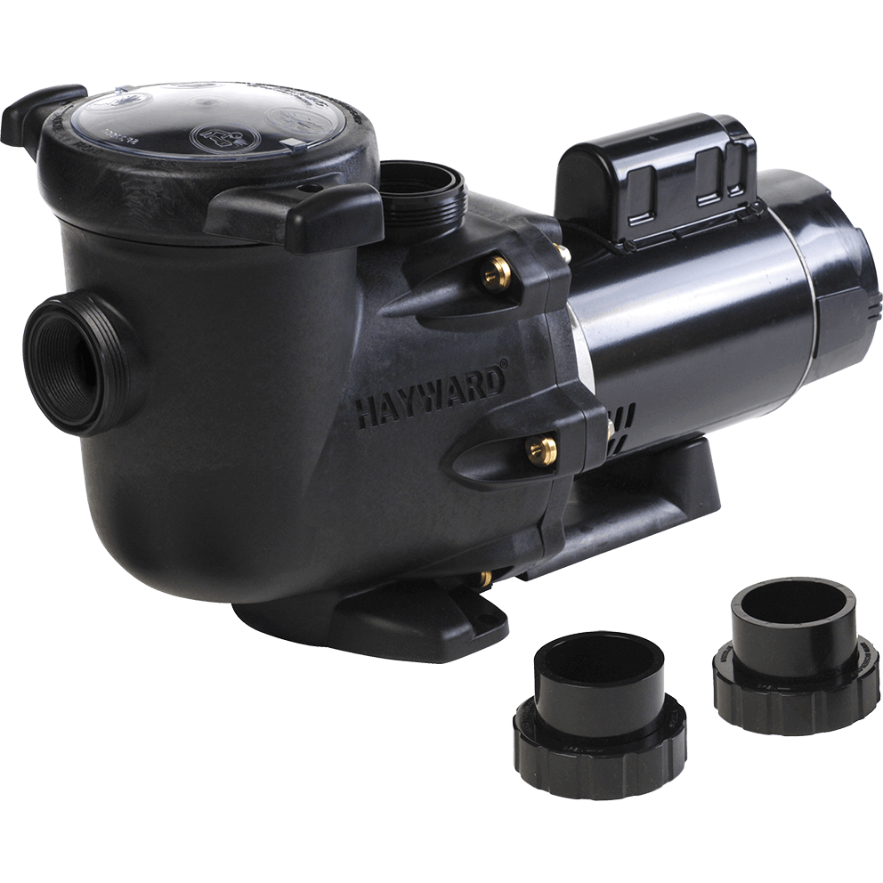 Angled front three quarter view of the Hayward TriStar Full-Rate Pool Pump with included plumbing unions displayed, isolated on a transparent background, showing the same black composite pump assembly with the strainer pot on the left and motor on the right, accompanied by two loose union fittings placed in front of the pump. The strainer housing features a large clear polycarbonate lid at the top with moulded warning symbols and two opposing black locking tabs for easy access to the no-rib debris basket inside. A threaded suction port is visible on the front face of the strainer, and a raised vertical discharge outlet extends upward behind the lid, both designed for 2 inch by 2.5 inch union connections. The pump volute is secured with evenly spaced brass-coloured fasteners, and the raised HAYWARD name is moulded into the side of the housing. The motor body is cylindrical with a smooth metallic dark finish and integrated ventilation near the rear, mounted on a sturdy black base foot. In the foreground, two black CPVC union assemblies are shown separately, each consisting of a short cylindrical tailpiece and a wide threaded locking collar, positioned upright to clearly show their internal openings and exterior threads, indicating quick installation and servicing compatibility with larger plumbing for improved hydraulic efficiency.