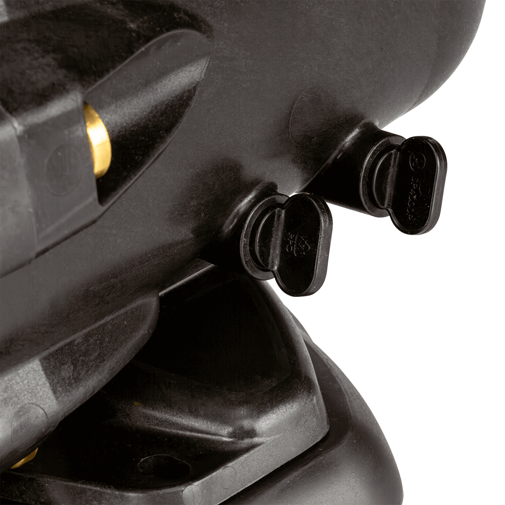 Close up side view of the Hayward TriStar VS Variable-Speed Pool Pump drain plugs and lower wet end, isolated on a transparent background. Two black twist style drain plugs extend horizontally from the lower right side of the housing, aligned one behind the other, each with a flat, rounded handle. The thick black base foot fills the lower portion with moulded contours and shallow recessed circles, while the textured composite housing rises above with a brass toned insert partially visible at the upper left edge.