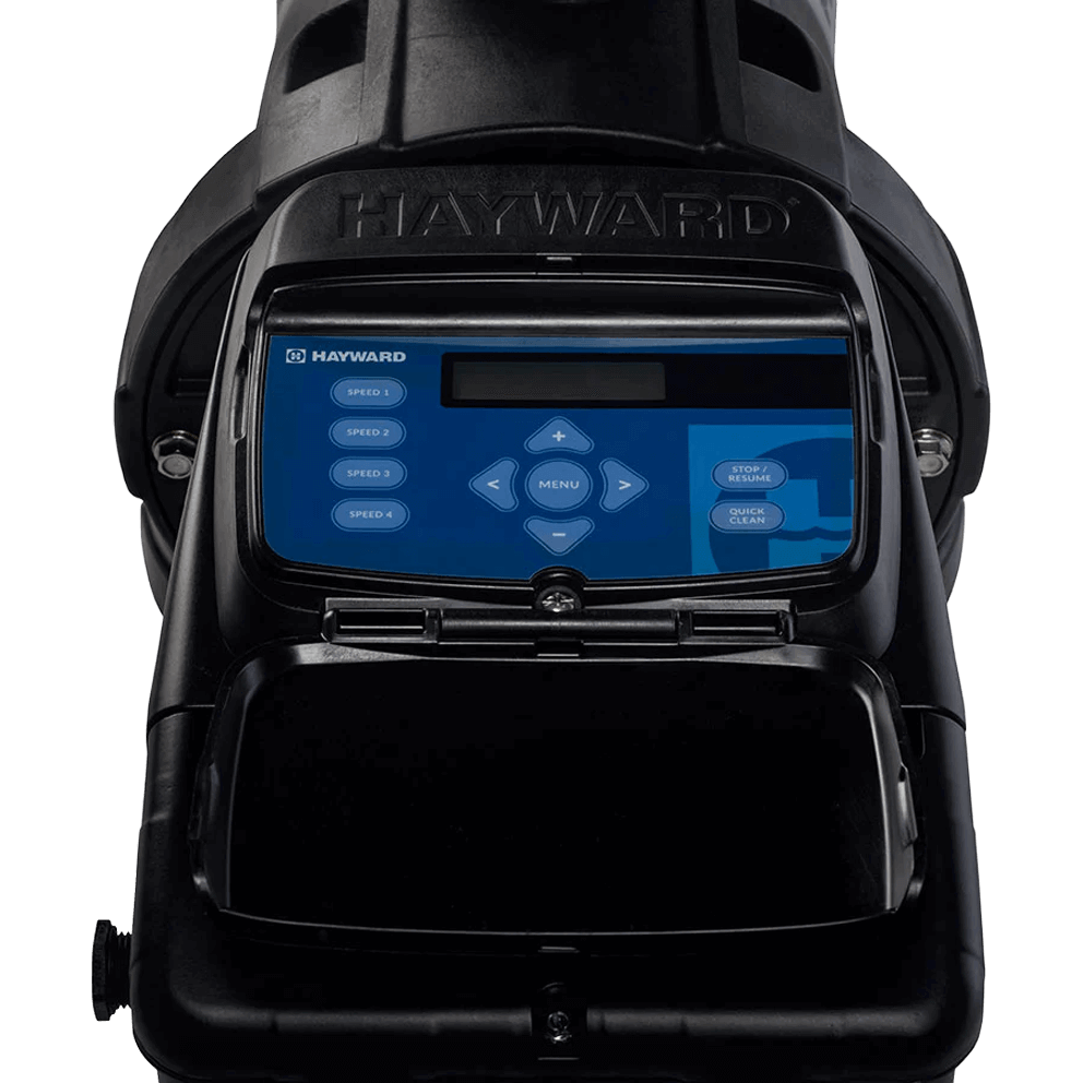 Front facing close up image of the Hayward TriStar XL digital control interface shown isolated on a transparent background. The rectangular control panel is framed in black and mounted centrally on the pump housing beneath the raised HAYWARD branding. The interface features a blue backlit display area at the top, directional arrow buttons surrounding a central menu button, and clearly labelled soft touch controls including speed selections, stop resume, and quick clean functions. The hinged lower cover is visible beneath the panel, indicating service access and weather protection, highlighting advanced digital control, programmability, and compatibility with remote automation systems.