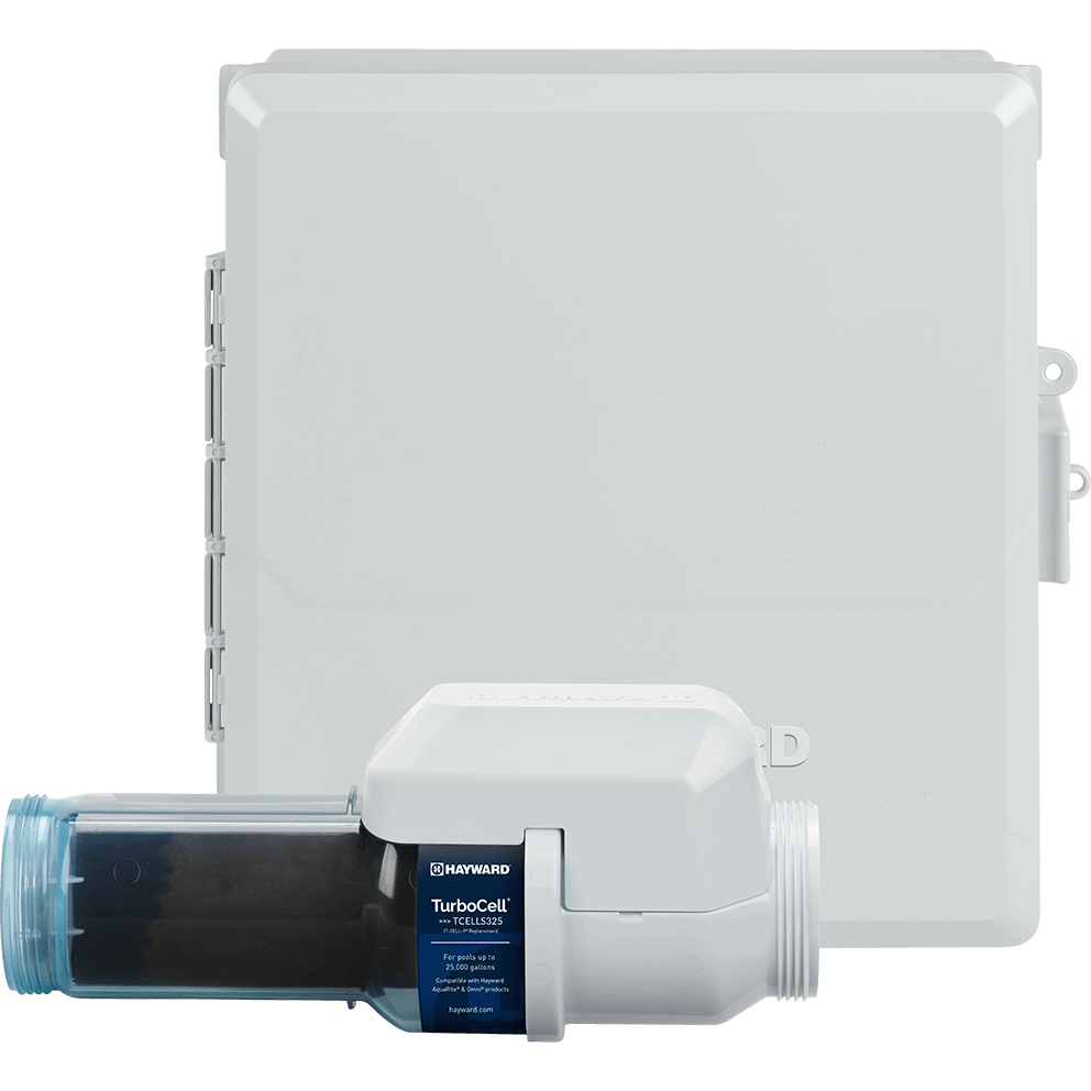 Front facing view of the Hayward AquaRite S325 Omni 25k Gallon System on a transparent background, showing the white control enclosure with the door closed and the TurboCell S325 clear salt cell positioned in front along the bottom edge. The closed enclosure appears as a large white square panel dominating the frame, with hinge detail visible along the left edge and mounting tabs and hardware protruding slightly on the right side. Across the lower foreground, the TurboCell S325 sits horizontally left to right, with the clear blue threaded union and transparent chamber on the left, the dark internal plates visible through the clear housing, and the white cell head and large white threaded connector on the right; the dark blue TurboCell label is centred near the transition between the clear housing and the white head.