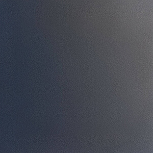 Close-up view of the Black Onyx structure material for the Visscher Luxe Sauna, featuring a deep charcoal to near-black surface with a fine, uniform pebble-textured finish. The material displays subtle tonal gradients from dark grey to black across the panel, creating a sleek, modern appearance. The matte surface diffuses light evenly, emphasising durability and a refined, contemporary aesthetic suitable for high-end outdoor sauna construction.